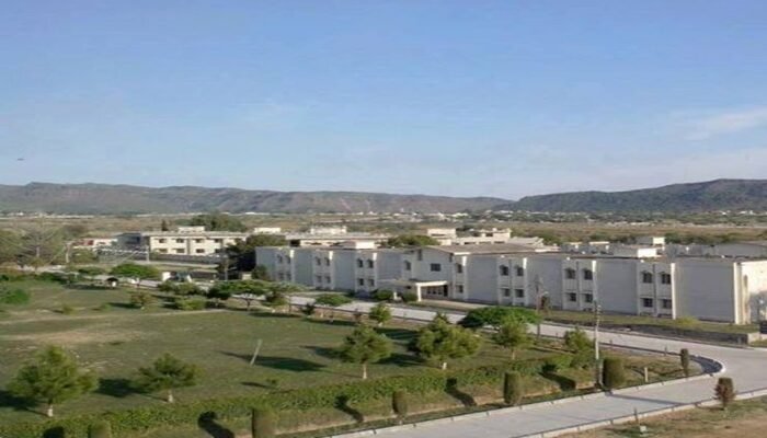 PIEAS campus, Nilore PIEAS campus in Nilore: long white academic blocks beside green lawns, with the Margalla foothills behind